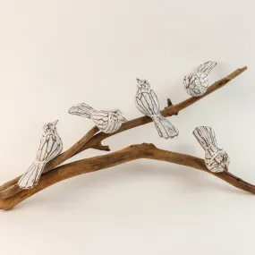 Five White Birds on Driftwood